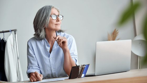 Lady thinking at desk